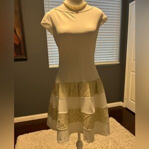 Italian designer sleeveless dress with gold lace tiered design. Size Small NWT